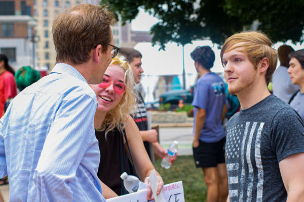 Tom talking with young climate activists
